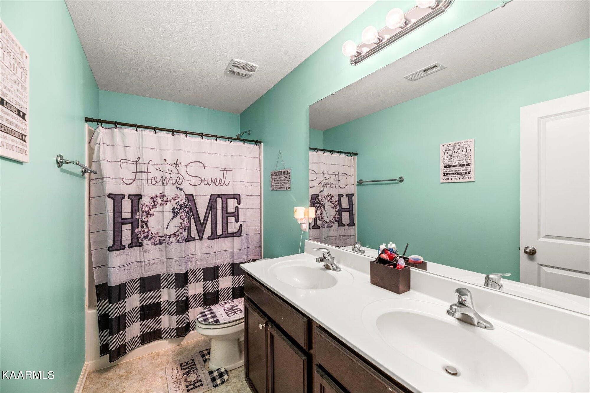 7136 Lawgiver Circle Corryton, TN 37721 - Photo 5 of 12 a bathroom with a sink toilet and shower