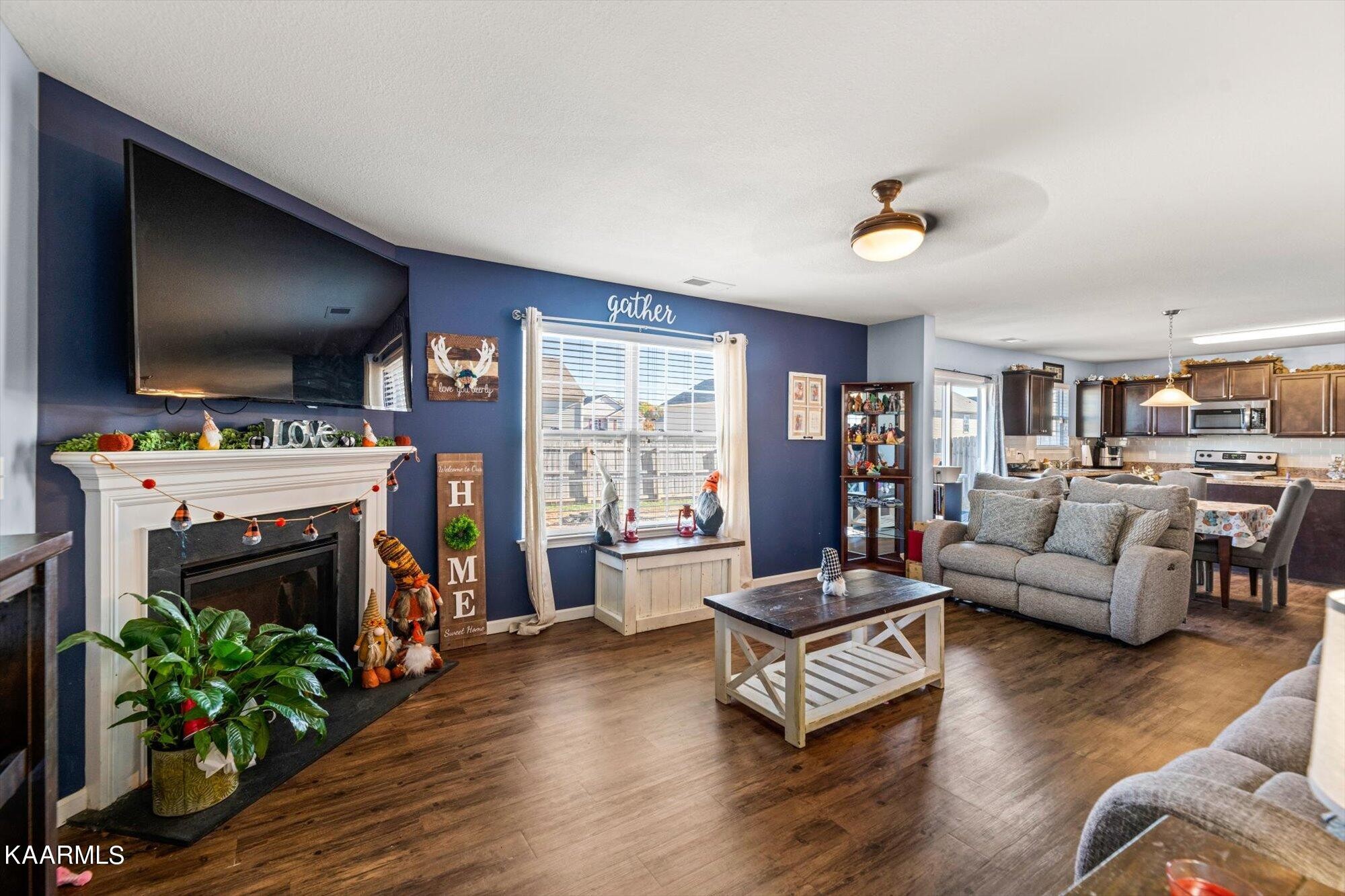 7136 Lawgiver Circle Corryton, TN 37721 - Photo 8 of 12 a living room with furniture and a flat screen tv
