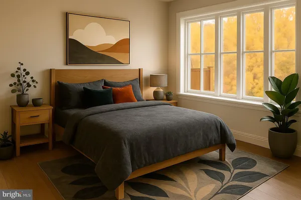 a bedroom with a bed a dresser and a potted plant