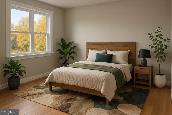a bedroom with a large bed and a potted plant