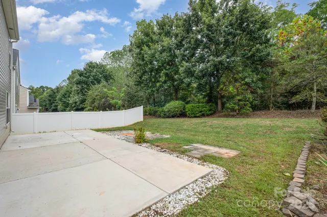 a backyard of a house with lots of green space