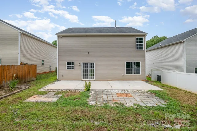 a picture of a bench in front of a wall