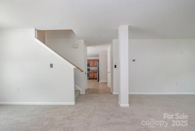 a view of a hallway with staircase