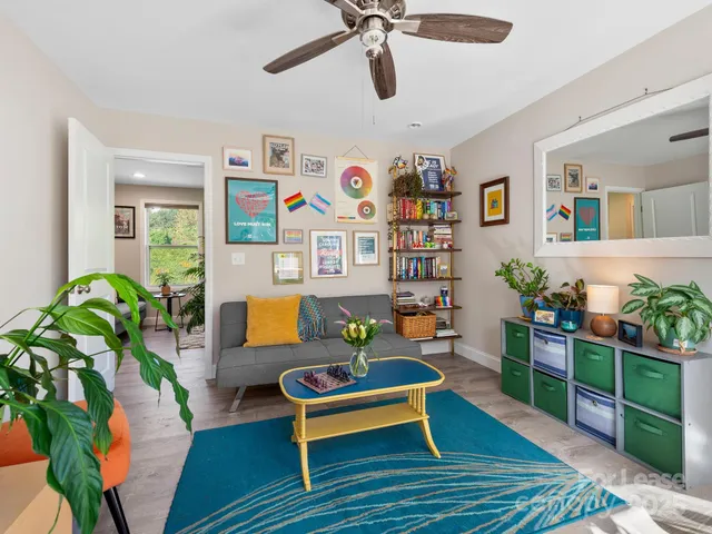 a living room with furniture and a table