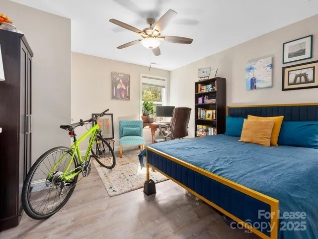 a view of room with cabinets and book shelf
