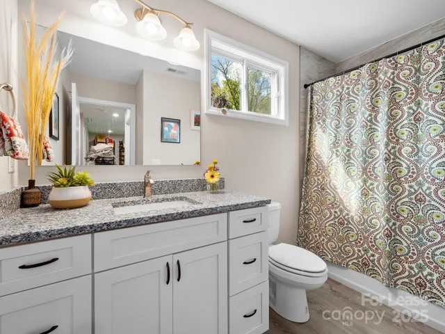 a view of balcony with wooden floor and outdoor seating