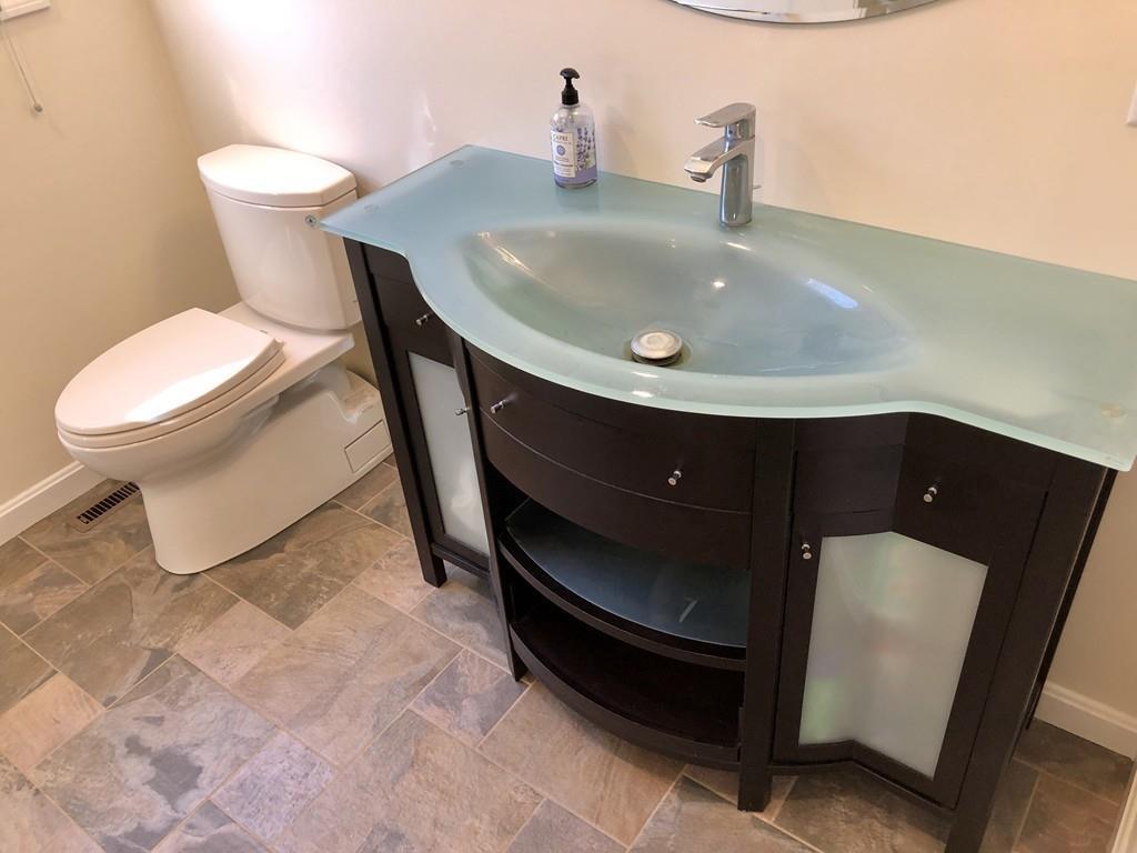 18 Cow Pond Brook Road Groton, MA 01450 - Photo 17 of 40 a bathroom with a sink and a toilet
