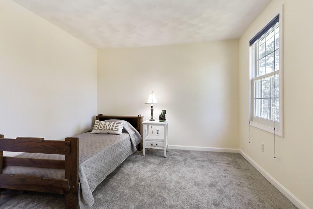 18 Cow Pond Brook Road Groton, MA 01450 - Photo 29 of 40 a room with a bed and a window