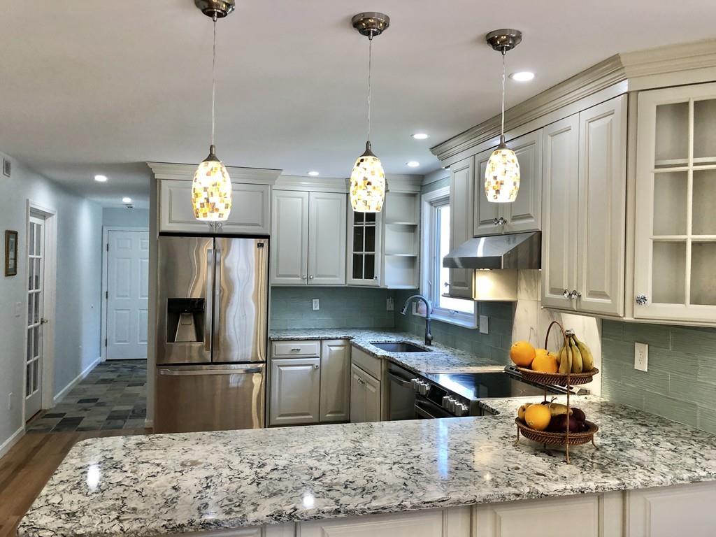18 Cow Pond Brook Road Groton, MA 01450 - Photo 3 of 40 a kitchen with refrigerator and window
