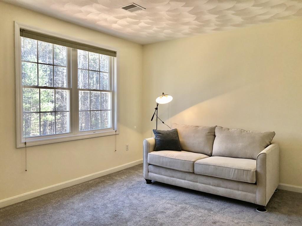 18 Cow Pond Brook Road Groton, MA 01450 - Photo 31 of 40 a living room with furniture and a window