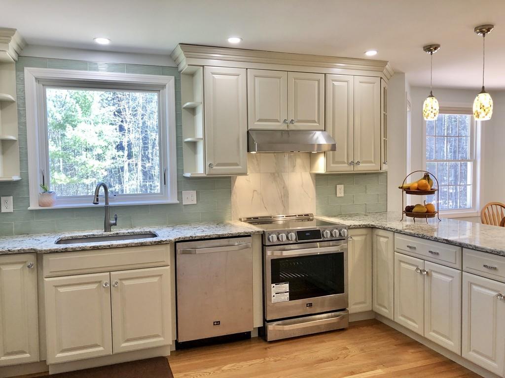 18 Cow Pond Brook Road Groton, MA 01450 - Photo 5 of 40 a kitchen with a stove a sink and a granite counter tops