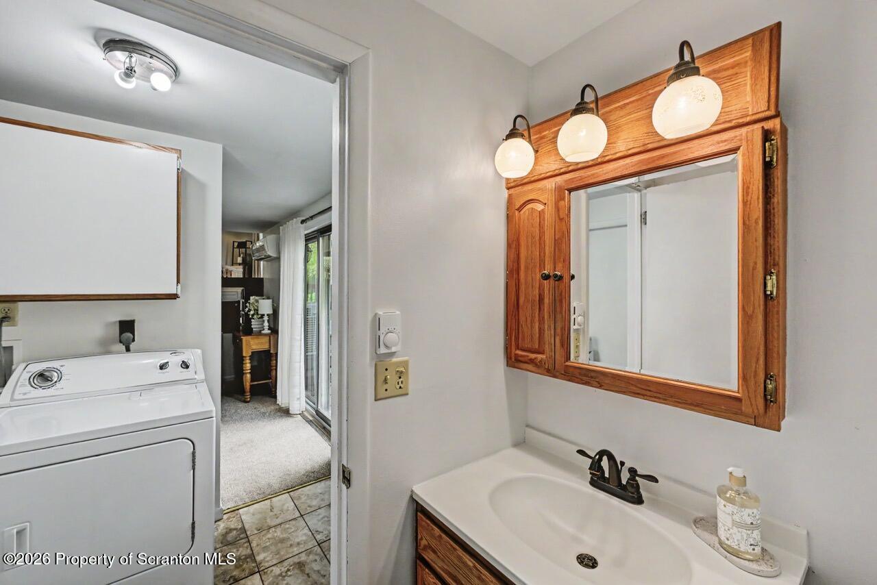 719 Scott Road Clarks Summit, PA 18411 - Photo 37 of 51 a bathroom with a sink and a mirror