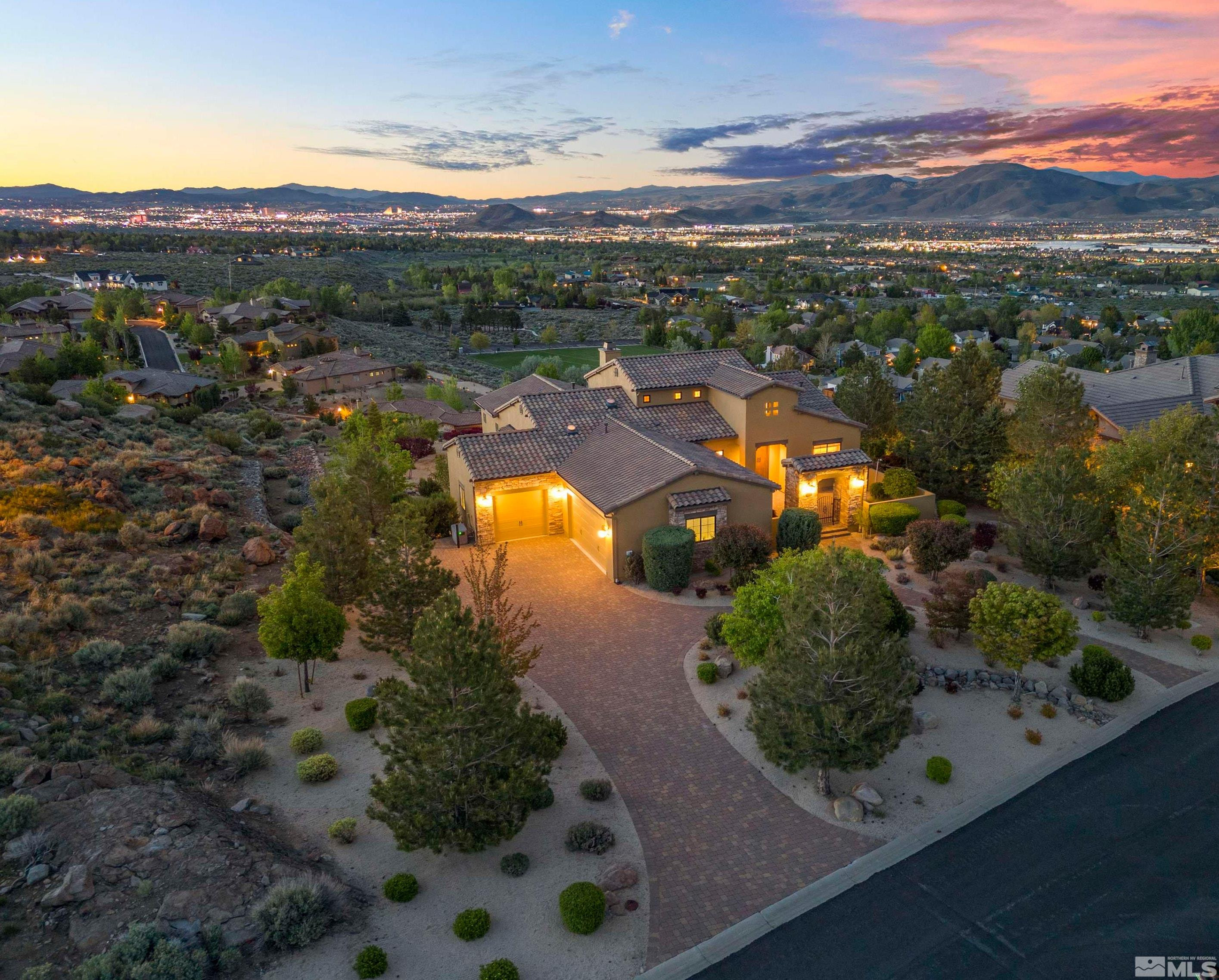 an aerial view of residential houses with outdoor space and river