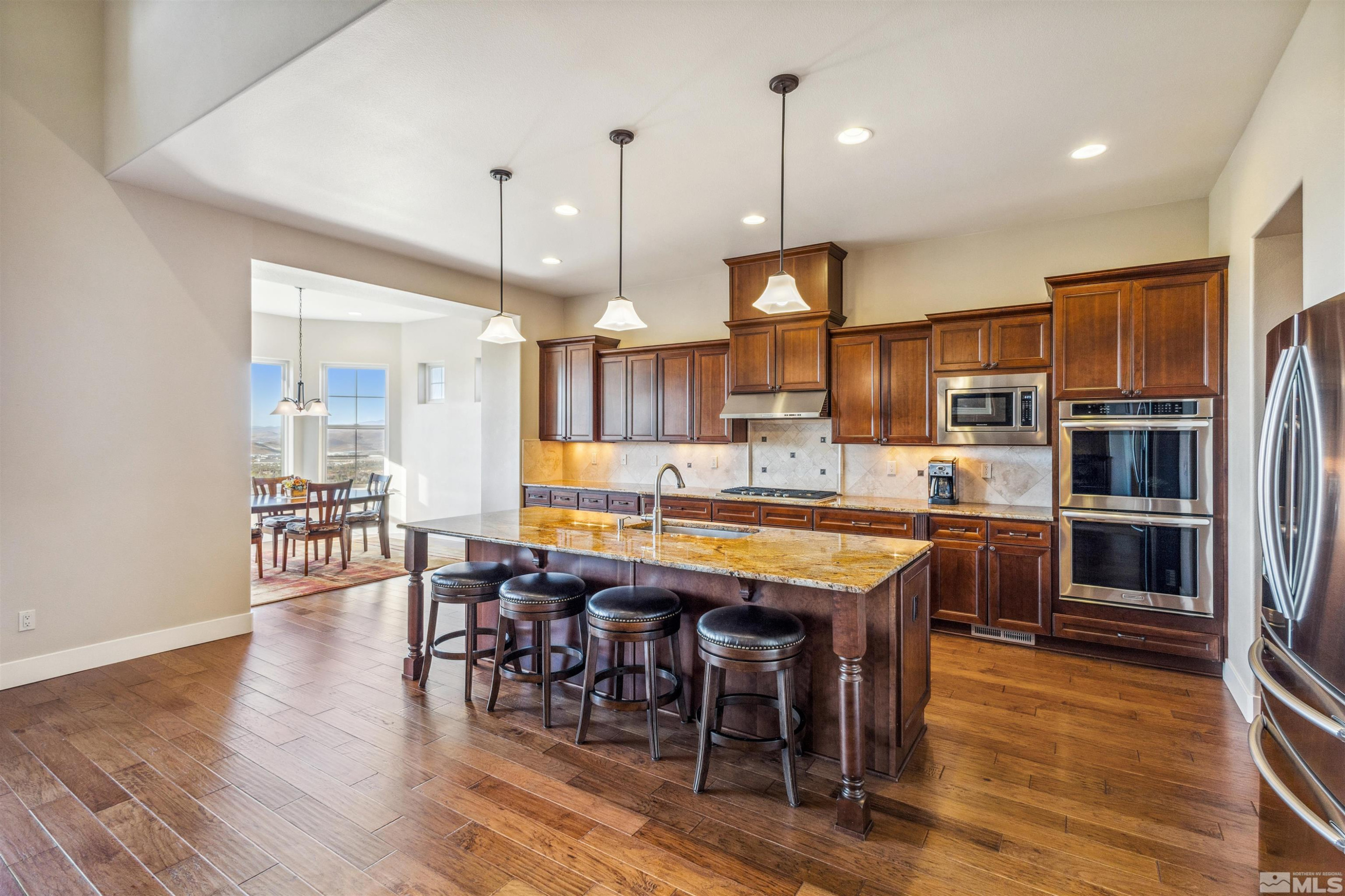 3705 Boulder Patch Reno, NV 89511 - Photo 17 of 41 a large kitchen with a table and chairs