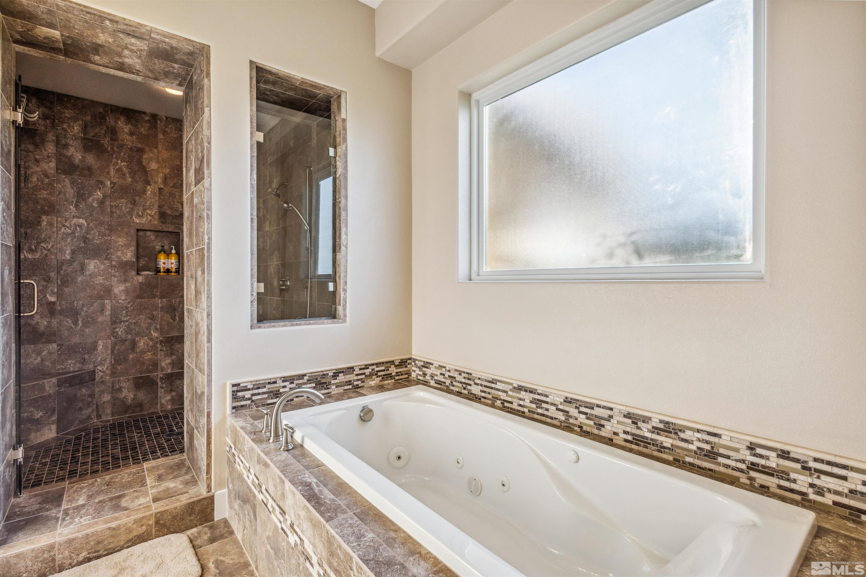3705 Boulder Patch Reno, NV 89511 - Photo 24 of 41 a bathroom with a tub and a shower