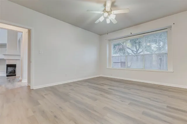 a kitchen with granite countertop a sink and cabinets