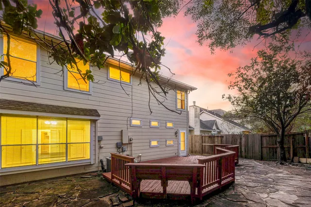 a view of a house with a iron fence