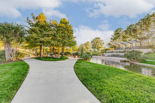 a view of yard with tree in the background