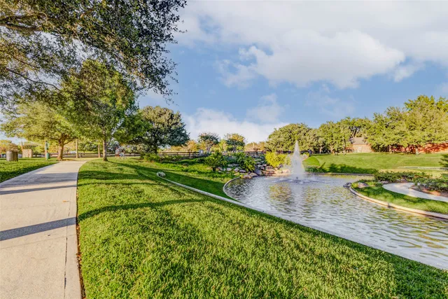 a view of a yard with cars