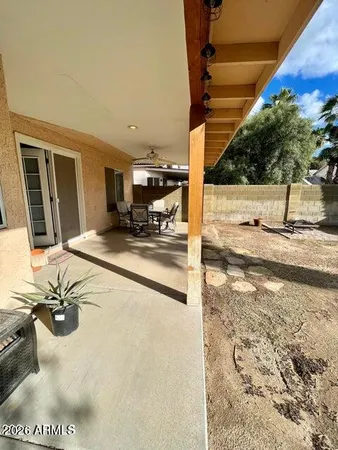 a view of a patio with wooden floor