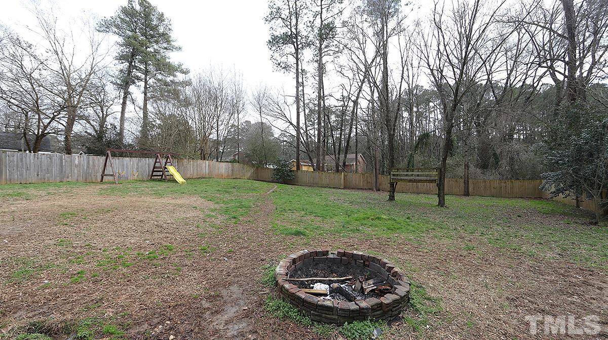 617 Locust Lane Raleigh, NC 27603 - Photo 15 of 15 a view of a backyard with swings
