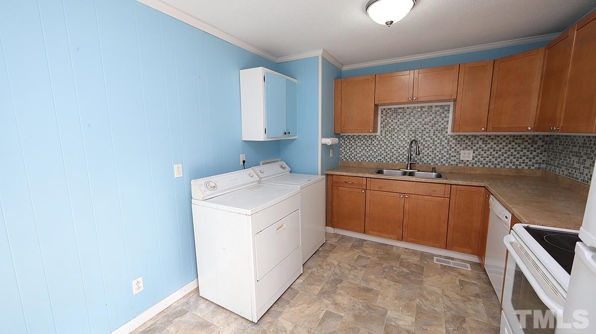 617 Locust Lane Raleigh, NC 27603 - Photo 6 of 15 a utility room with dryer and washer