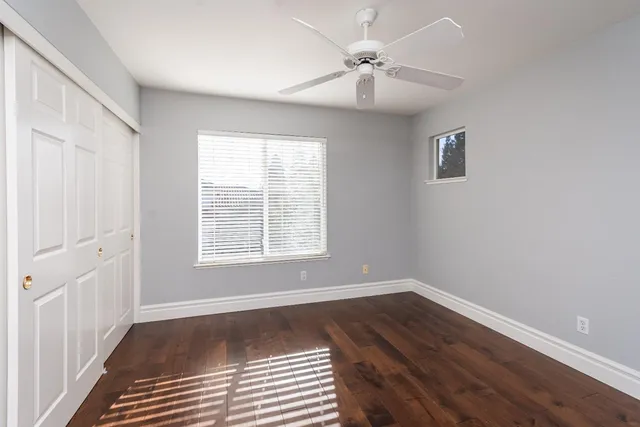 a view of a house with backyard sitting area and garden
