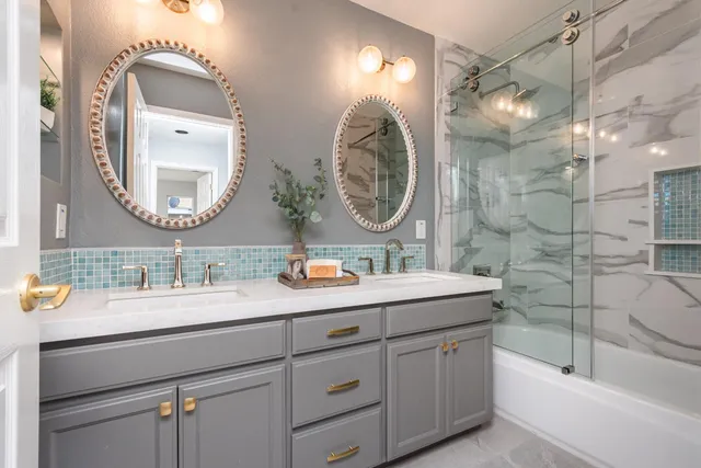 a front view of a house with a garden and trees