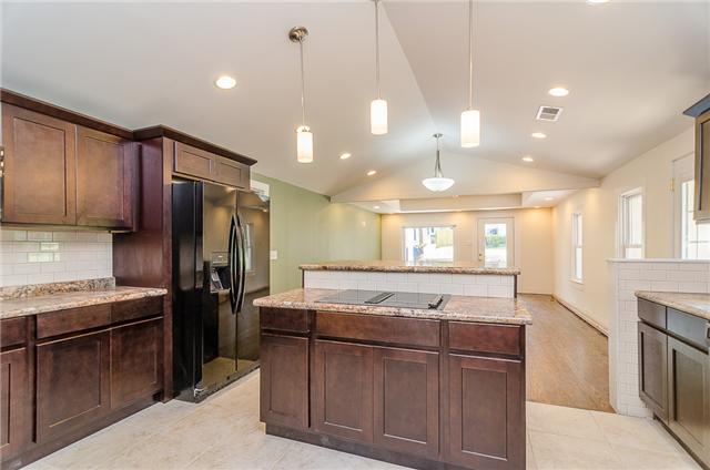 117 North Walnut Street Springfield, TN 37172 - Photo 4 of 20 You'll love the large island with bar seating, tile flooring and tile backsplash. Lot's of energy efficient recessed lighting too.