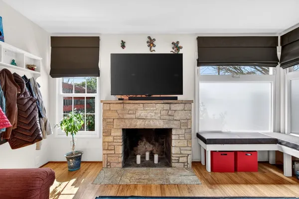 a living room with furniture flat screen tv and a fireplace
