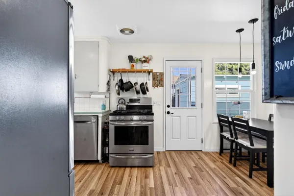 a kitchen with a sink appliances and cabinets