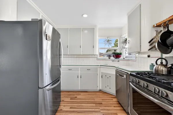 a view of a livingroom with furniture and wooden floor
