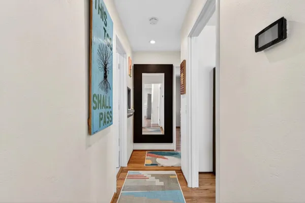 a room with a mirror and a sink