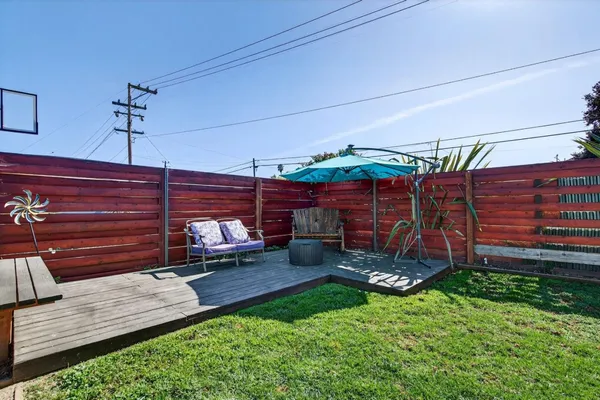 a view of a backyard with sitting area