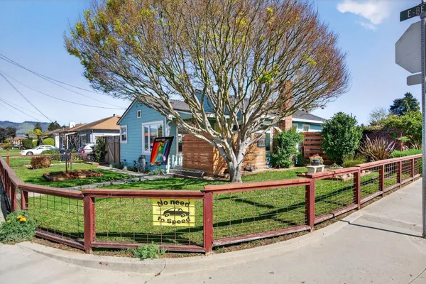 a view of backyard with a small cabin and chair