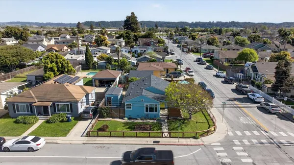 an aerial view of residential houses with outdoor space