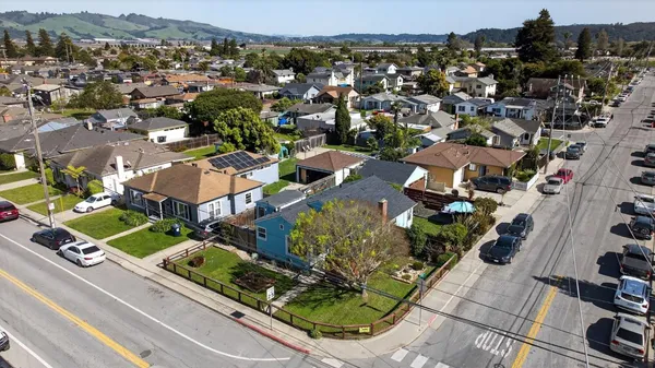 an aerial view of residential houses with outdoor space