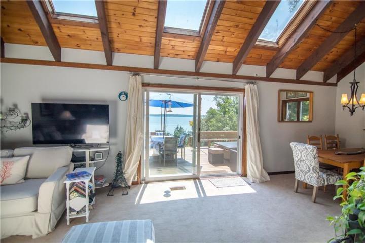 30 Rocky Point Road Stockton Springs, ME 04981 - Photo 12 of 31 Living room, sliding glass doors to deck