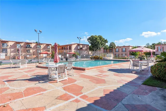 a view of a patio with a table and chairs