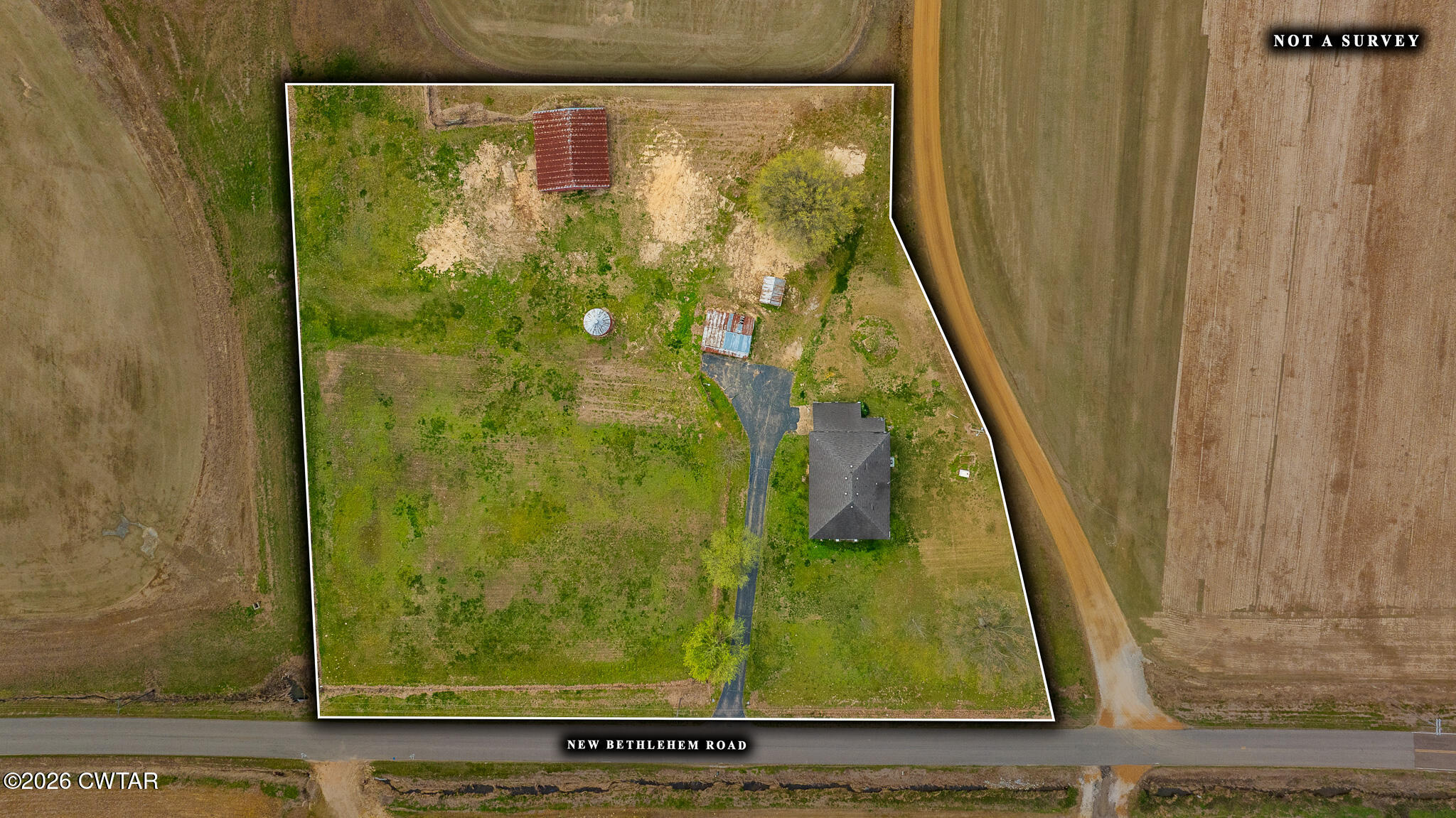 76 New Bethlehem Road Dyer, TN 38330 - Photo 2 of 39 a bathroom with a sink and shower curtain