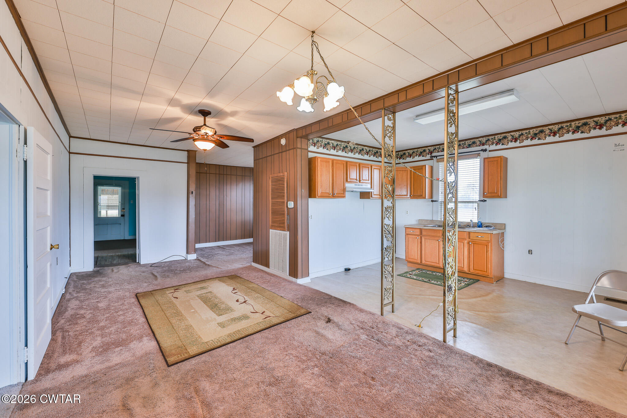 76 New Bethlehem Road Dyer, TN 38330 - Photo 30 of 39 a view of a hallway with couches and chandelier
