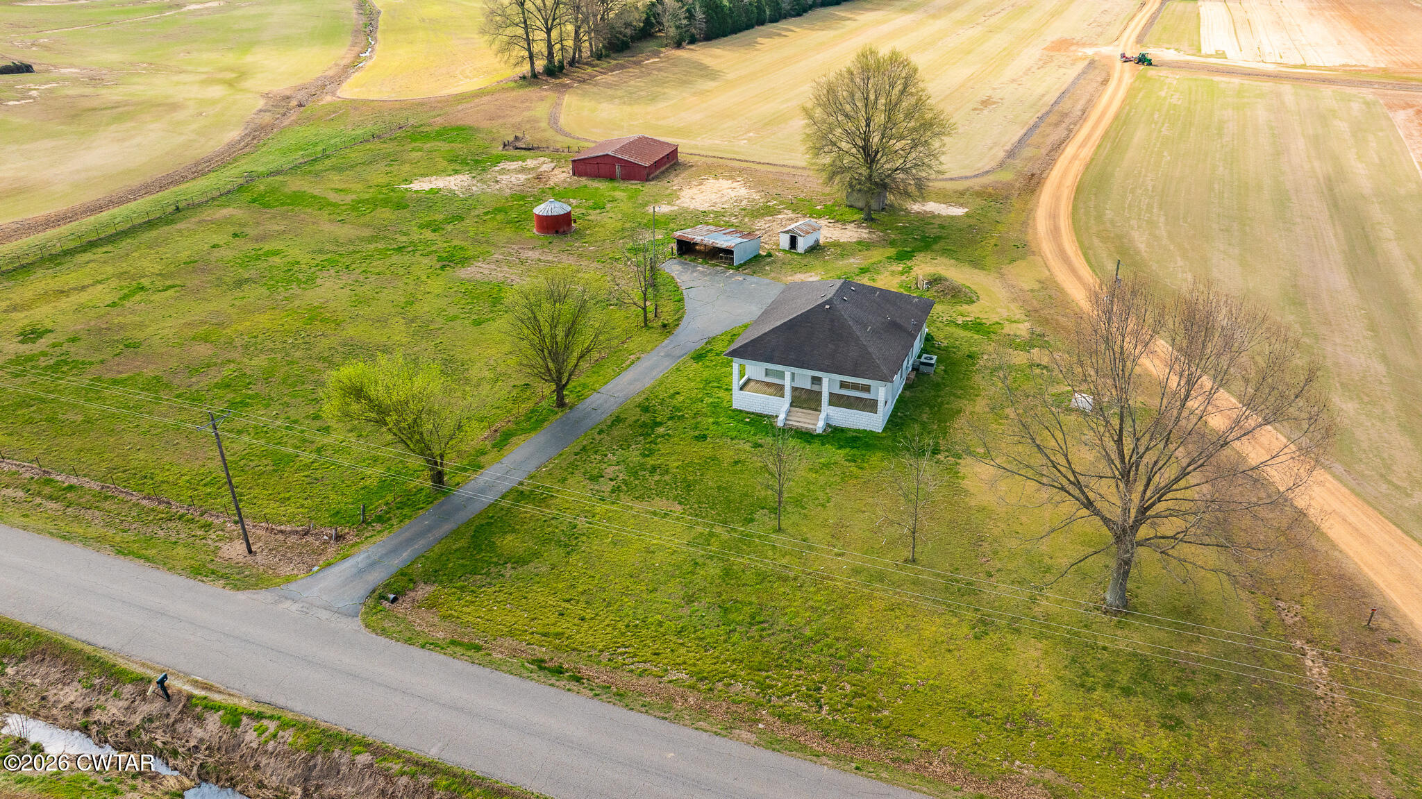 76 New Bethlehem Road Dyer, TN 38330 - Photo 7 of 39 a swimming pool with some trees in the background