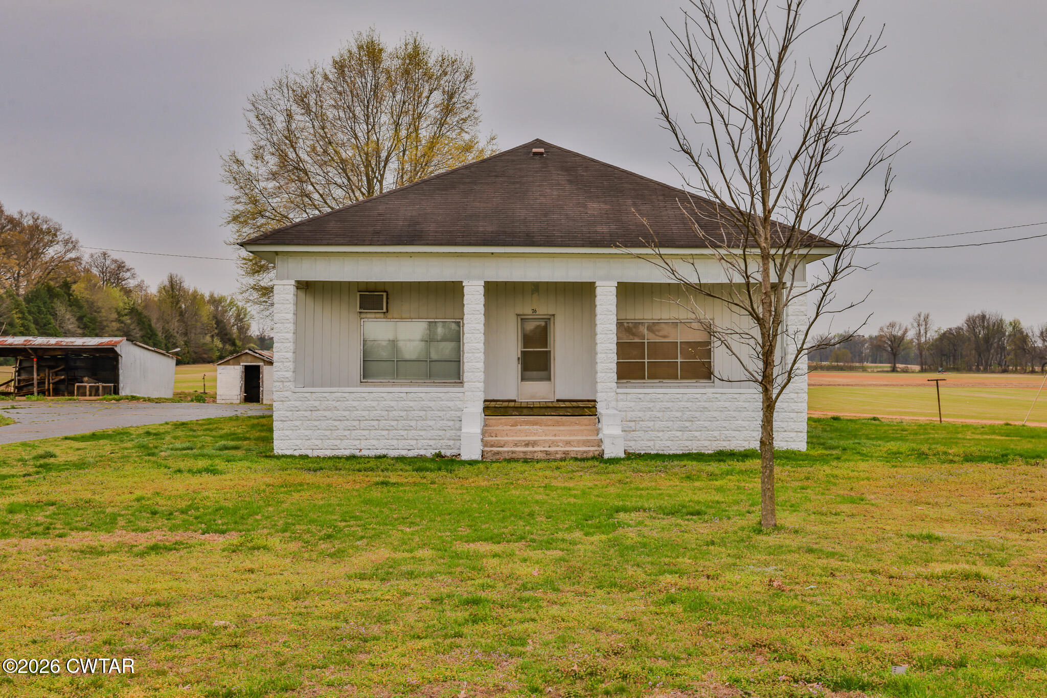 76 New Bethlehem Road Dyer, TN 38330 - Photo 8 of 39 a house that is sitting in the grass