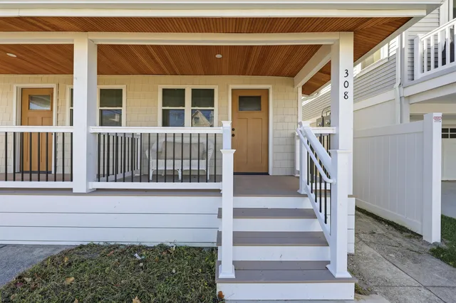 a front view of a house with a small yard