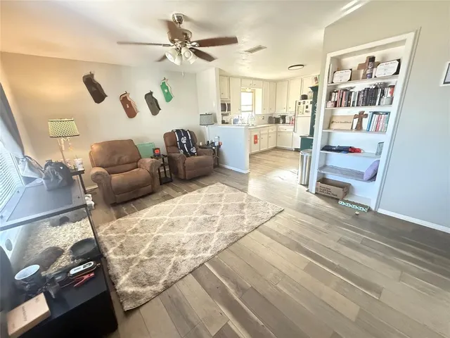 a living room with furniture and a rug