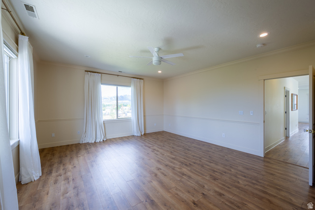 868 Braddock Lane Alpine, UT 84004 - Photo 31 of 64 Spacious room featuring wood-finish flooring, multiple windows, a ceiling fan, and recessed lighting