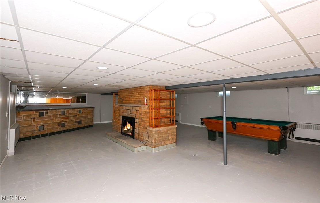 4597 Rock Cut Road Barberton, OH 44203 - Photo 26 of 44 *FINISHED BASEMENT (ADD FLOORING OF CHOICE) RECREATION ROOM GREAT FOR ENTERTAINING W/2ND FIREPLACE, ALSO WALKS OUT (UP STAIRS) TO THE BACK YARD ~