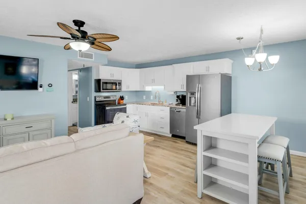 a bathroom with a sink a toilet and shower curtain