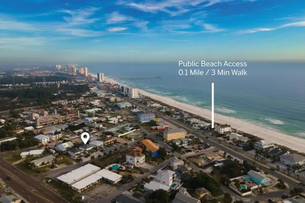 a view of a lobby with dining area and glass door
