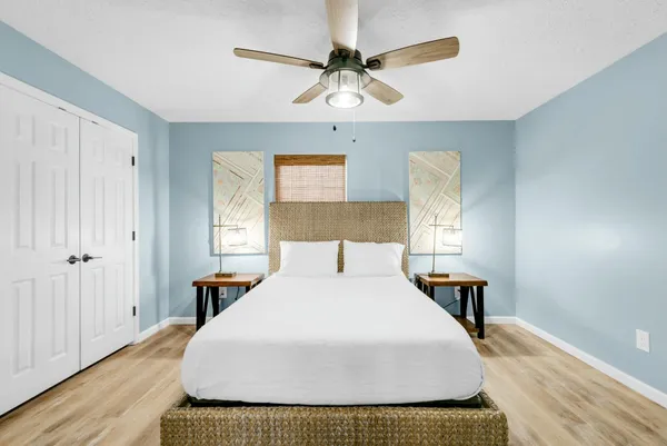 a living room with furniture potted plant and a chandelier